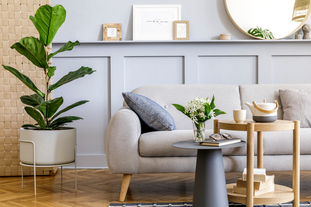 A staged living room with plants and Scandinavian design