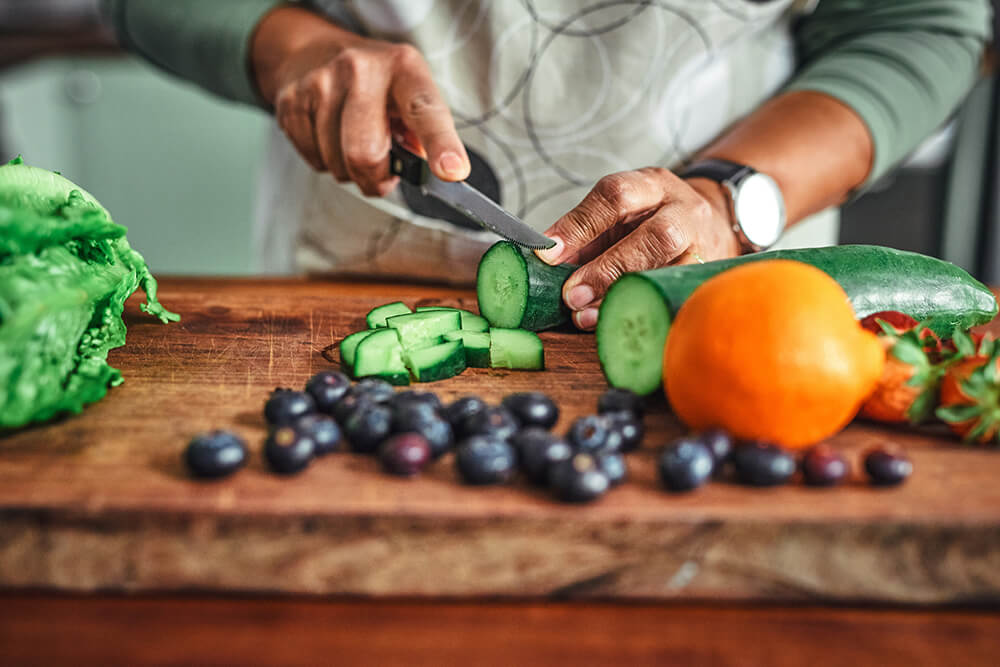 Person cutting nutritious vegetables