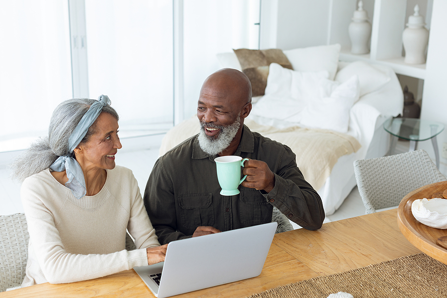 A senior couple researches together.