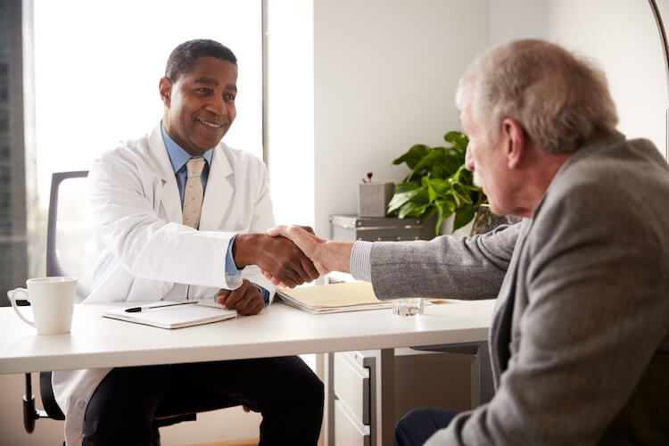 Senior man having consultation with doctor.