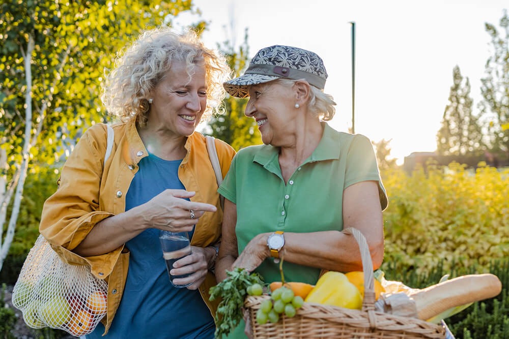 Ladies carrying fresh groceries
