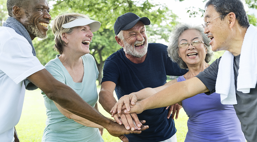 A group of seniors socialize after working out.