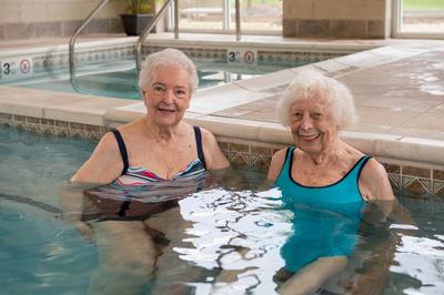 Seniors relaxing after enjoying invigorating swimming exercises