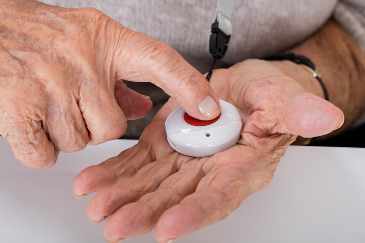 Senior holds medical alert button