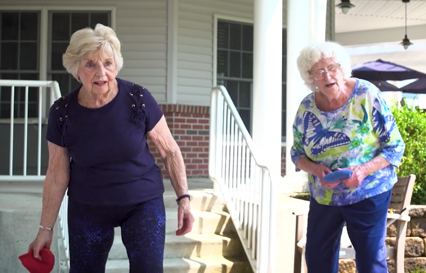 women playing cornhole